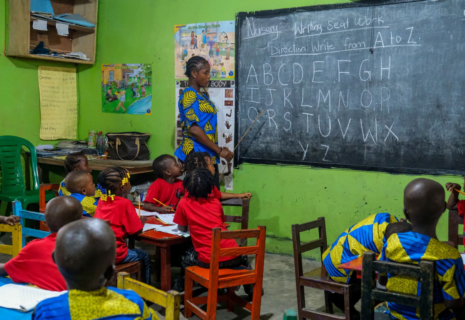 A teacher taking a class at the blackboard